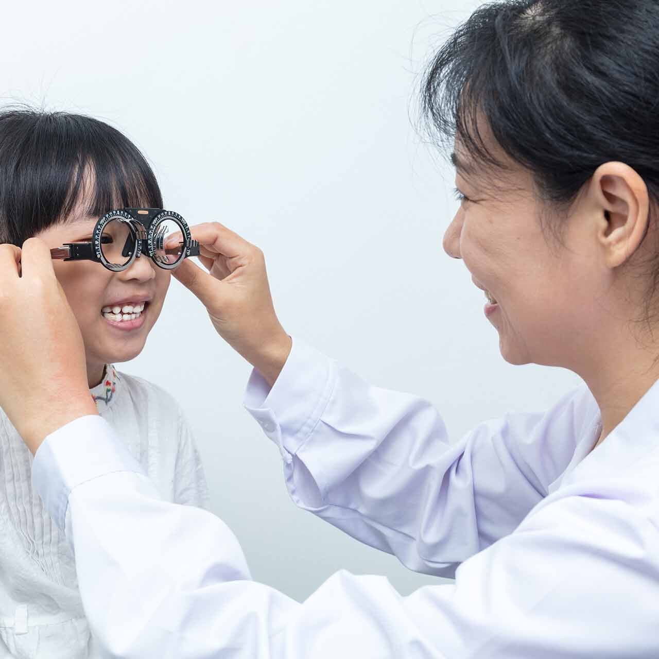 Asian,little,chinese,girl,doing,eyes,examination,by,ophthalmologist,in